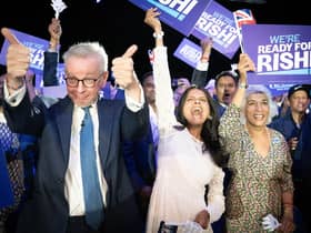 Michael Gove (left), Rishi Sunak's wife Akshata Murthy (centre) and mother Usha Sunak (right) cheer former chancellor Rishi Sunak during a hustings event at Wembley Arena in London. Picture: Stefan Rousseau/PA Wire