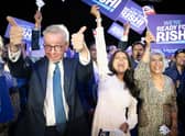 Michael Gove (left), Rishi Sunak's wife Akshata Murthy (centre) and mother Usha Sunak (right) cheer former chancellor Rishi Sunak during a hustings event at Wembley Arena in London. Picture: Stefan Rousseau/PA Wire