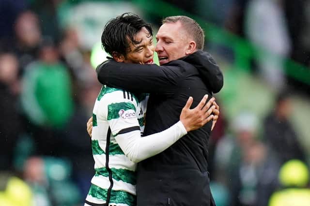 Brendan Rodgers speaks with Reo Hatate after Celtic's 3-1 win over Kilmarnock.