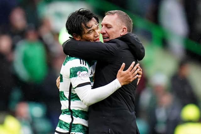 Brendan Rodgers speaks with Reo Hatate after Celtic's 3-1 win over Kilmarnock.