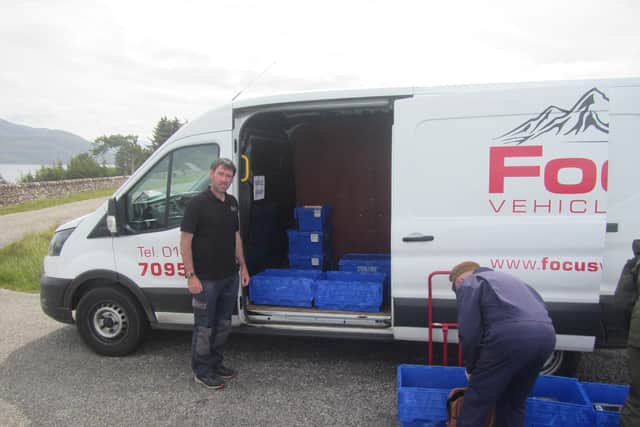 The book crates are loaded and unloaded to the Transit van.