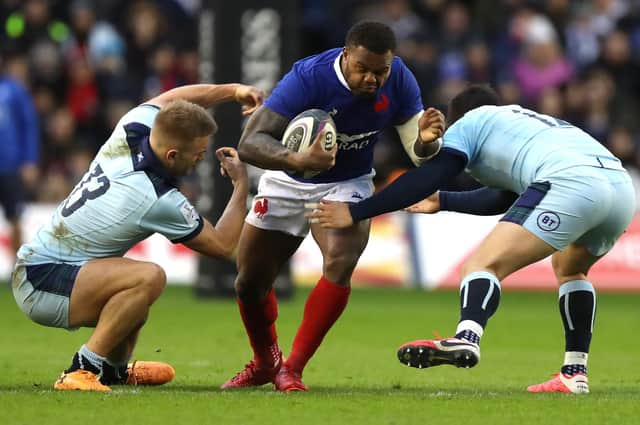 Virimi Vakatawa of France is tackled by Chris Harris (L) and Sam Johnson during last year's Six Nations match against Scotland. The sides will meet against on March 26. Picture: David Rogers/Getty Images
