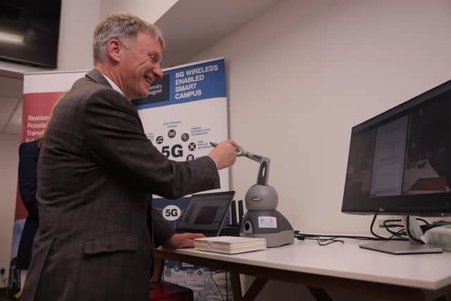 Minister for business, trade, tourism and enterprise Ivan McKee participating in 5G-enabled teleoperation demonstration.