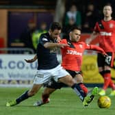 Tom Taiwo tussles with Harry Forrester in March 2016 (Picture: SNS Group Rob Casey)
