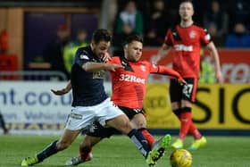 Tom Taiwo tussles with Harry Forrester in March 2016 (Picture: SNS Group Rob Casey)