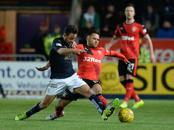 Tom Taiwo tussles with Harry Forrester in March 2016 (Picture: SNS Group Rob Casey)