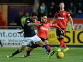 Tom Taiwo tussles with Harry Forrester in March 2016 (Picture: SNS Group Rob Casey)