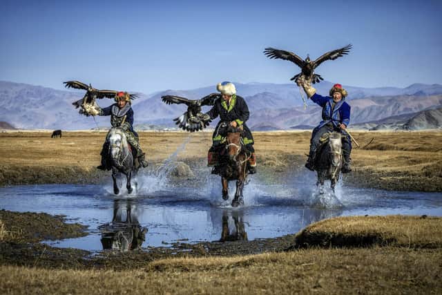 These incredible images depict 'Berkutchi' - Mongolian hunters who use trained golden eagles to forage food - from Bayan-(div)lgii, an area located in the Altai Mountains of western Mongolia.