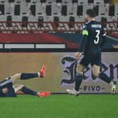 Ryan Christie lies on the ground in jubilation after scoring for Scotland.