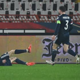 Ryan Christie lies on the ground in jubilation after scoring for Scotland.