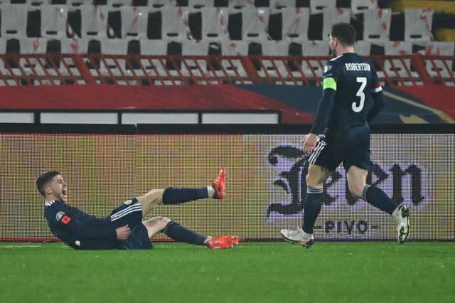 Ryan Christie lies on the ground in jubilation after scoring for Scotland.