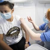 Nurse Eleanor Pinkerton administers a coronavirus vaccine to one of the health and social care staff at the NHS Louisa Jordan Hospital in Glasgow in January.