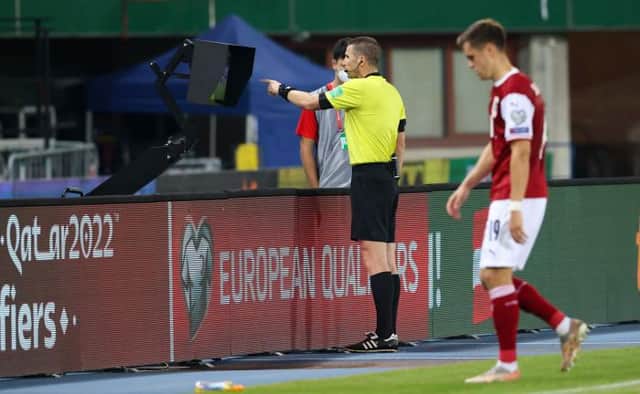 VIENNA, AUSTRIA - SEPTEMBER 07: Referee Georgi Kabakov consults the VAR monitor during the FIFA World cup Qualifer between Austria and Scotland at the Ernst-Happel-Stadion, on September 07, 2021, in Vienna, Austria. (Photo by Alan Harvey / SNS Group)