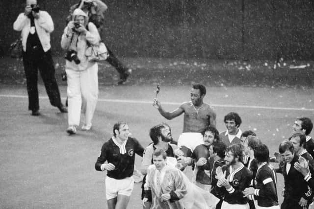 Pele is carried off the Giants Stadium field by his New York Cosmos teammates after his final football game, in East Rutherford, New Jersey, October 1, 1977.