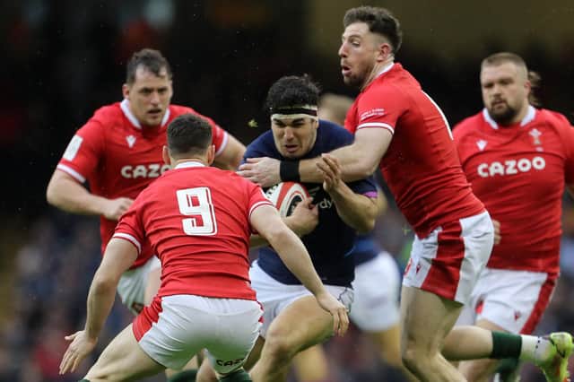 Scotland hooker Stuart McInally tries to break past the Welsh defence during the Six Nations defeat in Cardiff.