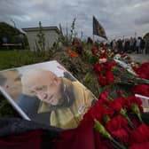 A portrait of the owner of private military company Wagner Group Yevgeny Prigozhin lays at an informal memorial next to the former 'PMC Wagner Centre' in St. Petersburg. Picture: AP Photo/Dmitri Lovetsky