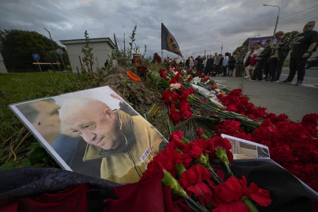 A portrait of the owner of private military company Wagner Group Yevgeny Prigozhin lays at an informal memorial next to the former 'PMC Wagner Centre' in St. Petersburg. Picture: AP Photo/Dmitri Lovetsky