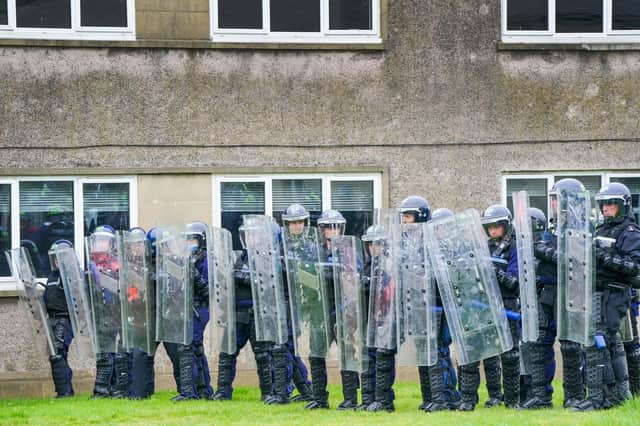 Police Scotland officers take part in a role-play exercise recreating a protest during a COP26 public order training at Craigiehall Army barracks. Picture: Jane Barlow/PA Wire