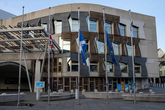 The flags outside the Scottish Parliament at Holyrood, Edinburgh, fly at half mast following the death of Alex Salmond.