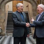 Outgoing Moderator Lord Wallace greets his successor, the Rev Dr Iain Greenshields, at the Assembly Hall.