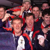 The Inverness players celebrate their victory with manage Steve Paterson on the team bus back in 2000.