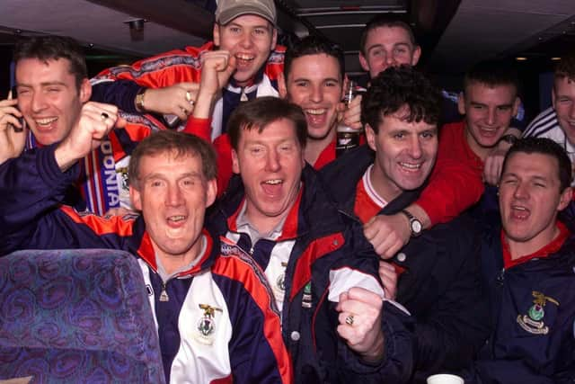 The Inverness players celebrate their victory with manage Steve Paterson on the team bus back in 2000.