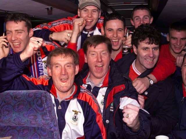 The Inverness players celebrate their victory with manage Steve Paterson on the team bus back in 2000.