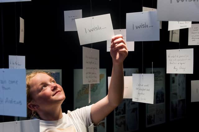 Keevah, a pupil from Ballumbie Primary School, Dundee has a look at the What if…?/Scotland exhibition.