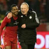 Aberdeen manager Neil Warnock and Luis 'Duk' Lopes share a laugh at full time after the 3-3 draw with Motherwell. (Photo by Craig Foy / SNS Group)