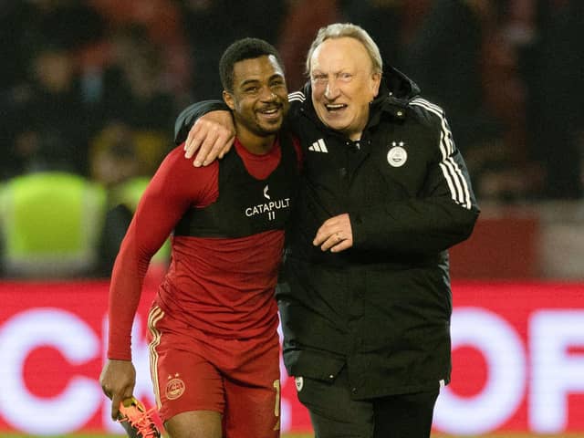Aberdeen manager Neil Warnock and Luis 'Duk' Lopes share a laugh at full time after the 3-3 draw with Motherwell. (Photo by Craig Foy / SNS Group)