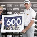 DP World Tour chief executive Keith Pelley presented Stephen Gallacher with a framed print to commemorate his 600th start on the circuit in the AVIV Dubai Championship in 2021. Picture: Oisin Keniry/Getty Images.