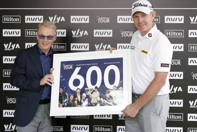 DP World Tour chief executive Keith Pelley presented Stephen Gallacher with a framed print to commemorate his 600th start on the circuit in the AVIV Dubai Championship in 2021. Picture: Oisin Keniry/Getty Images.