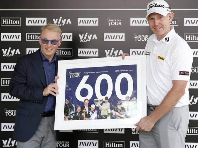 DP World Tour chief executive Keith Pelley presented Stephen Gallacher with a framed print to commemorate his 600th start on the circuit in the AVIV Dubai Championship in 2021. Picture: Oisin Keniry/Getty Images.