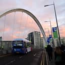 An electric bus crosses the Clyde Arc during COP26 UN Climate Summit in Glasgow (Paul Ellis/AFP via Getty Images)