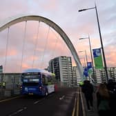 An electric bus crosses the Clyde Arc during COP26 UN Climate Summit in Glasgow (Paul Ellis/AFP via Getty Images)