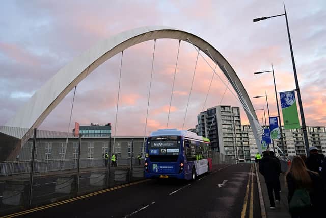 An electric bus crosses the Clyde Arc during COP26 UN Climate Summit in Glasgow (Paul Ellis/AFP via Getty Images)