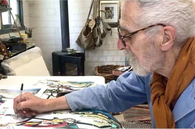 John Byrne in his studio, working on poster designs for his play Underwood Lane