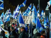 Scottish Independence supporters are seen at a demo outside Holyrood, the Scottish Parliament, on November 23, 2022 in Edinburgh, Scotland. Earlier today, the UK Supreme Court judges unanimously rejected the Scottish government's argument that it can hold a second independence referendum. (Photo by Peter Summers/Getty Images)