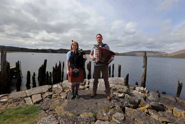 Gary Innes, BBC Scotland presenter and founding member of Scottish supergroup Mànran, launches Scottish Folk Day with piper Katie McEwan of Oban High School Pipe Band, who are just back from New York’s Tartan Week. Picture: Kevin McGlynn