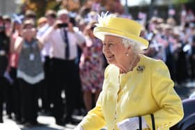 Schools in Scotland are expected to be closed during a public holiday on the day of the Queen's funeral. Pictured is the Queen on a visit to Greenfaulds High School in Cumbernauld (Photo: John Devlin).