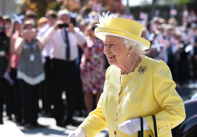 Schools in Scotland are expected to be closed during a public holiday on the day of the Queen's funeral. Pictured is the Queen on a visit to Greenfaulds High School in Cumbernauld (Photo: John Devlin).
