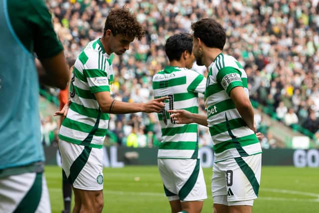 Nicolas Kuhn (R) celebrates with Matt O'Riley after putting Celtic 3-1 ahead over Hibs. (Photo by Alan Harvey / SNS Group)