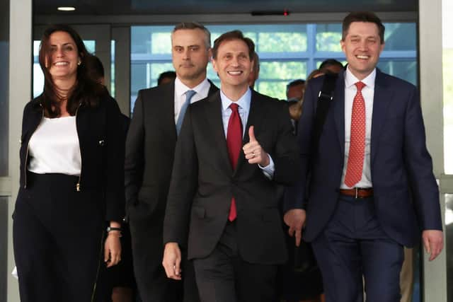 Dominion Voting Systems CEO John Poulos (2nd L) leaves with members of his legal team, including Davida Brook (L), Justin Nelson (3rd L) and Stephen Shackelford (R) from the Leonard Williams Justice Center where Dominion was suing FOX News for defamation in Delaware Superior Court after a settlement has been reached. Photo by Alex Wong/Getty Images