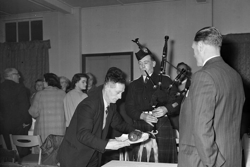 Jas Cairney pipes in the haggis at the Hearts Supporters Club, Tranent, Burns Supper in 1964.