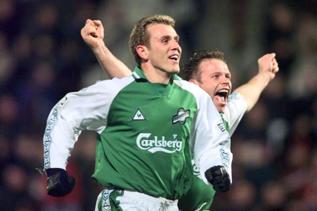 Franck Sauzee celebrates alongside Hibs team-mate John Hughes in a 1999 derby.