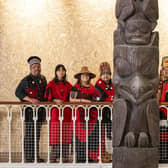 Delegates from the Nisgaa Nation with the Niisjoohl Memorial Pole, which is to be returned to Canada from National Museums Scotland.