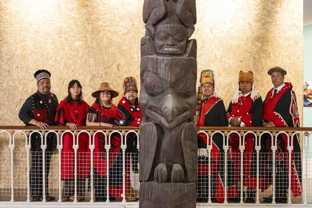 Delegates from the Nisgaa Nation with the Niisjoohl Memorial Pole, which is to be returned to Canada from National Museums Scotland.