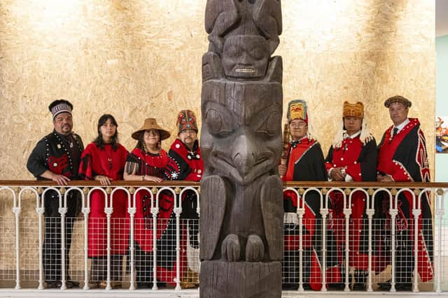 Delegates from the Nisgaa Nation with the Niisjoohl Memorial Pole, which is to be returned to Canada from National Museums Scotland.