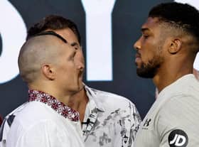 Ukraine's Oleksandr Usyk and Britain's Anthony Joshua face each other during a public weighing ahead of the heavyweight boxing rematch for the WBA, WBO, IBO and IBF titles between them, in the Saudi Red Sea city of Jeddah.