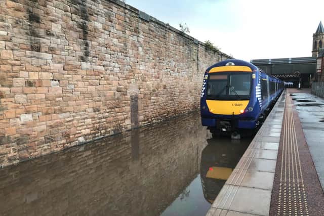 British Transport Police, which patrols Scotland’s rail network, shared a photo of a completely flooded track at Perth Station, urging passengers to be wary of delays after “significant disruption”.